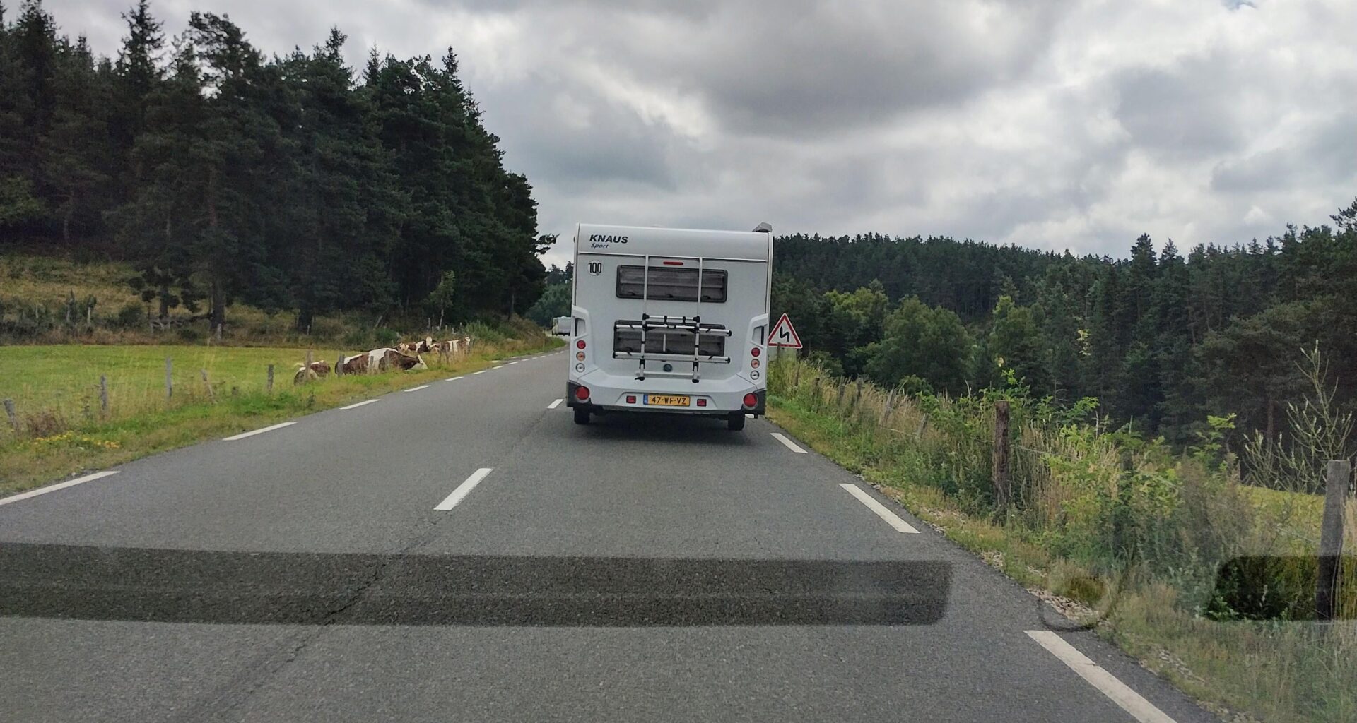 A Dutch person is slowing me on this nice backcountry road, what should I do?