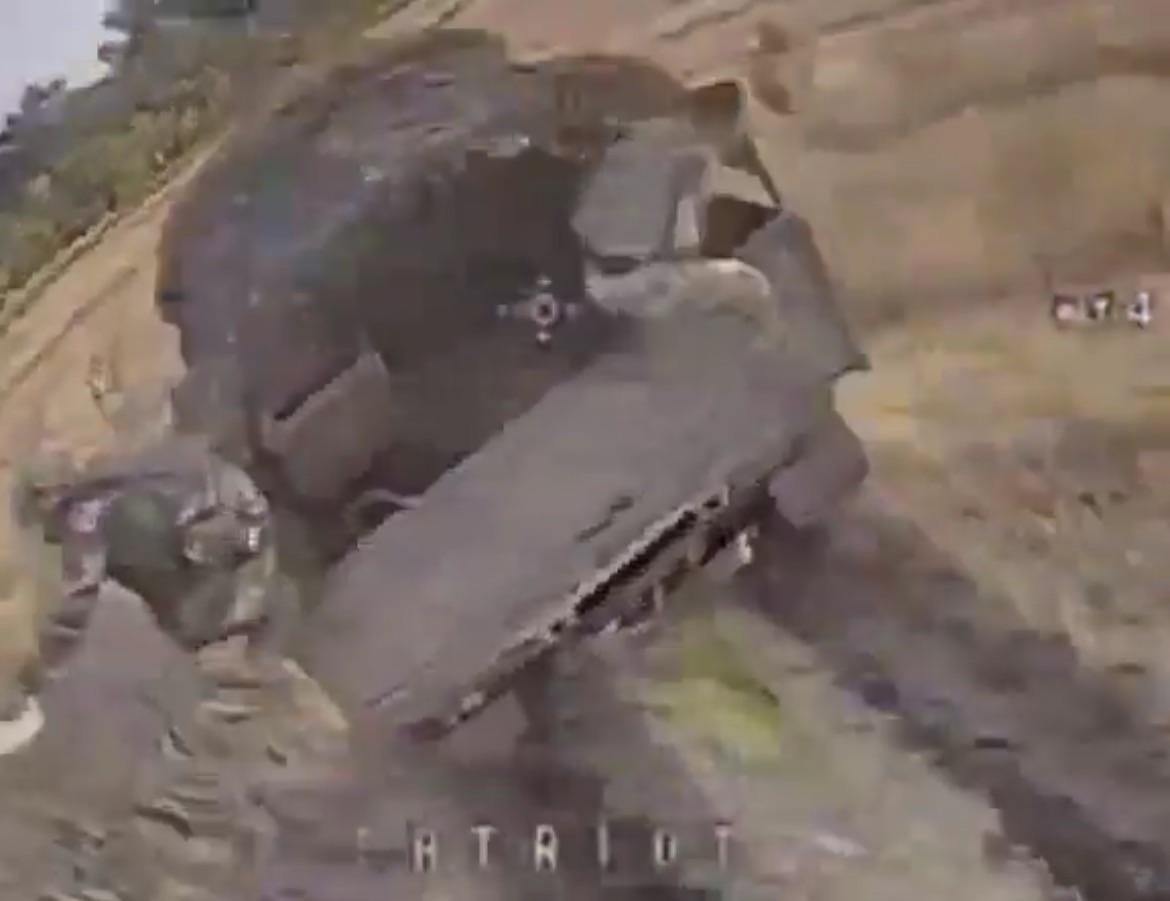 The final image seen from a Ukrainian drone - about to impact the back of a Russian troop transport truck - in the Kursk Oblast.