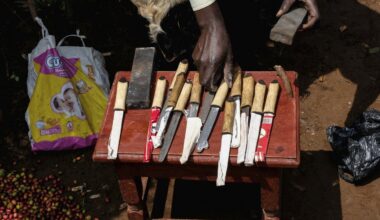 A mass circumcision is marketed to tourists in a remote area of Uganda. Some are angrily objecting