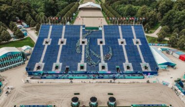 Volunteers assembled in the shape of the Agitos in the Versailles stands