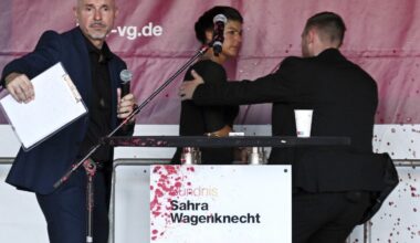 Prominent German leftist politician sprayed with a red liquid, likely paint, during campaign event