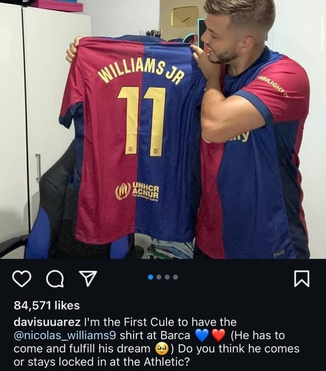 Raphinha reacts to a fan giving his jersey number to N. Williams