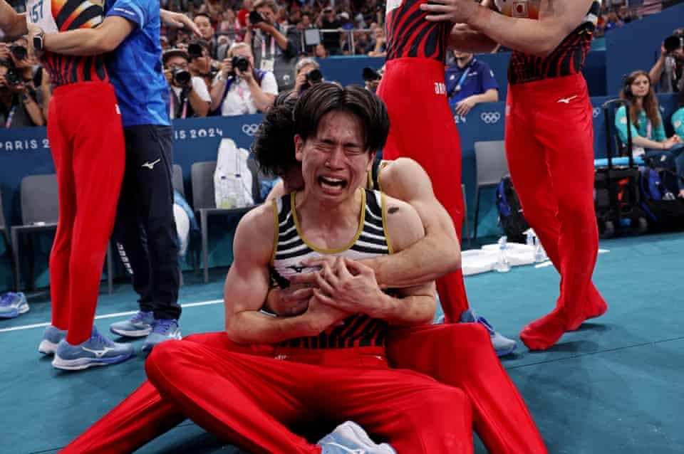 Kazuma Kaya of Japan is overwhelmed as he celebrates winning gold in the men’s artistic gymnastics final.