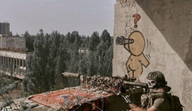 Ukrainian Army sniper conducting training in the empty city of Pripyat, Chernobyl – earlier in the summer. He was armed with a Barrett M82 - overlooking the Palace of Culture.