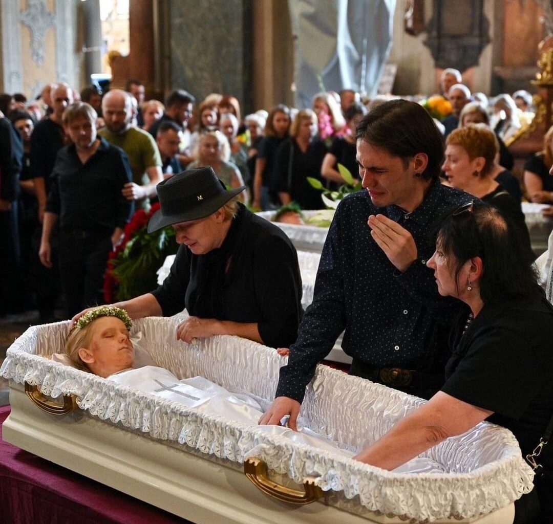 Ukrainian heartbroken father and husband Yaroslav, at the funeral of his family that were killed by the Russian missile strike on Lviv - Wife and mother Yevheniia and her three daughters - Yaryna, Dariia and Emilia.