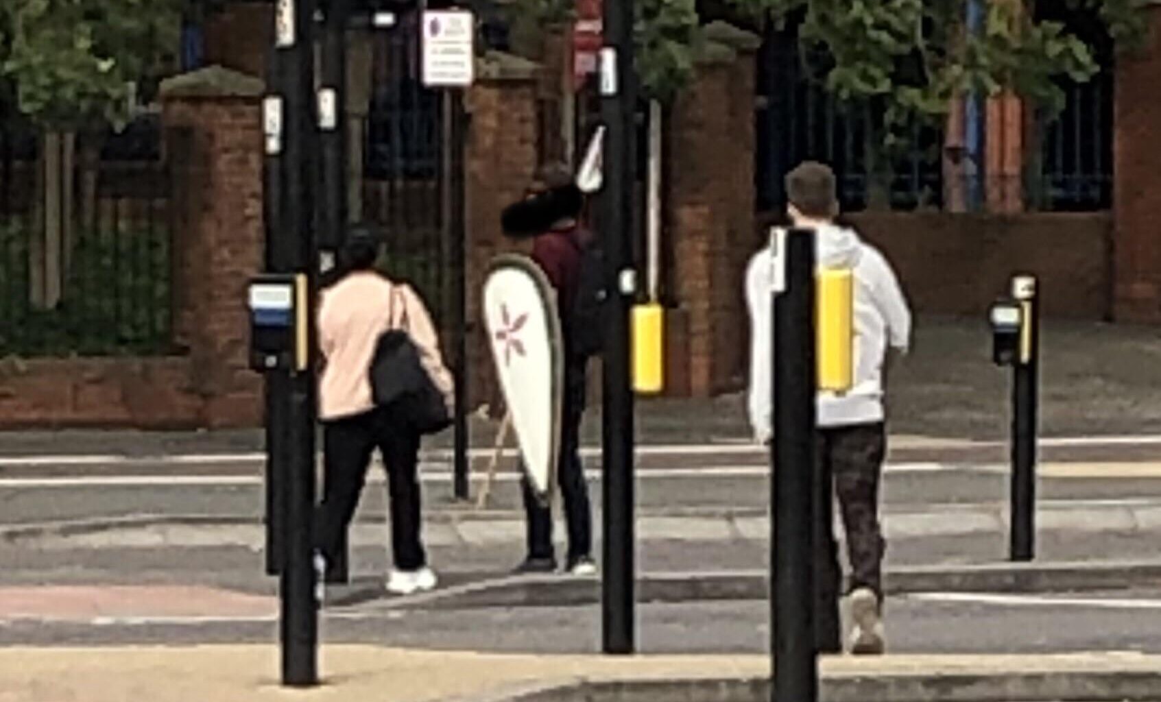 Just a chap casually carrying a pike and a shield