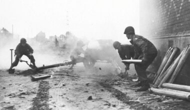 Troops of the 35th Division 9th U.S. Army turn a German Pak 40 75mm anti-tank gun against its former owners along the Rhine-Herne Canal near Recklinghausen in April 1945