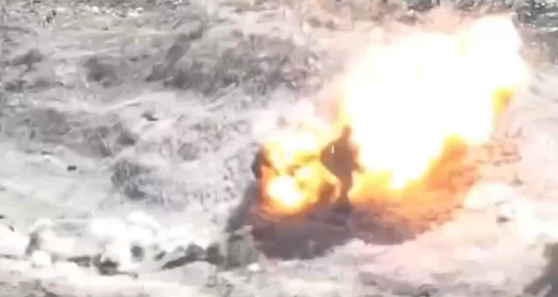 Russian soldier approaches an unexploded FPV drone and the drone remotely detonates