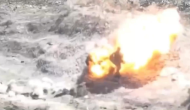 Russian soldier approaches an unexploded FPV drone and the drone remotely detonates