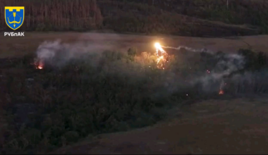 Russian infantry hidden in a forest attempt to shoot down Ukrainian drone that's dropping thermite on them.