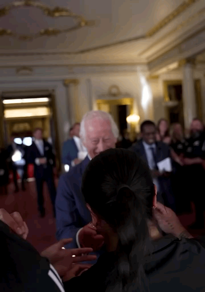 The New Zealand Black Ferns giving King Charles a hug