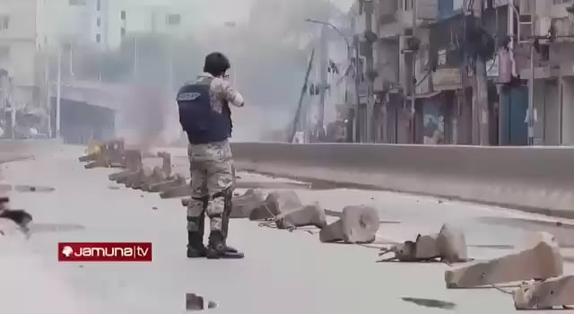 Bangladeshi police armed forces battalion using live rounds against protesters in Dhaka on 5 August 2024.