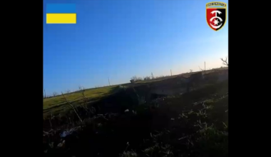 Ukrainian fighter shoot visible enemy at close range with small arms fire during assault on Russian-held bridge near Bakhmut. May 2023