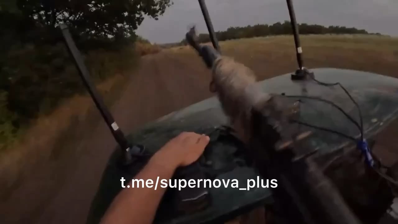 GoPro view of Russian soldier in back of speeding tactical golf cart firing rifle at pursuing FPV drone (which nearly hits them)