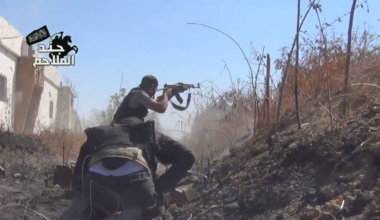 FSA fighters advance at a crouch while under fire towards Syrian Army held positions - al-Qasimiya, Damascus - 10/15/2013