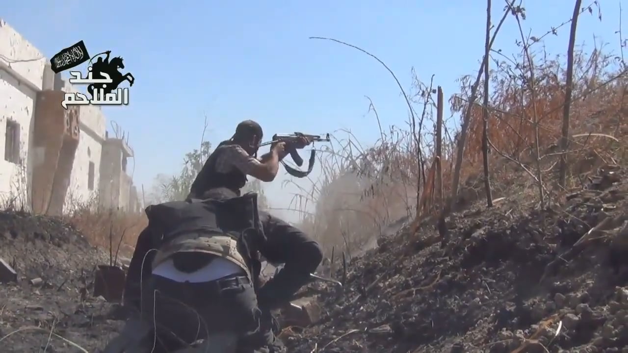 FSA fighters advance at a crouch while under fire towards Syrian Army held positions - al-Qasimiya, Damascus - 10/15/2013