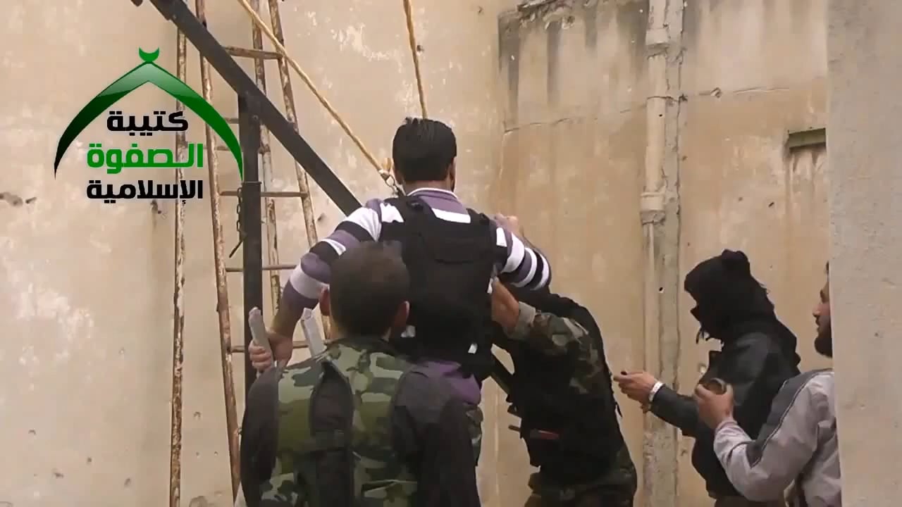 FSA fighters rig a slingshot to launch improvised grenades in order to harass SAA controlled positions - Aleppo - 11/28/2013