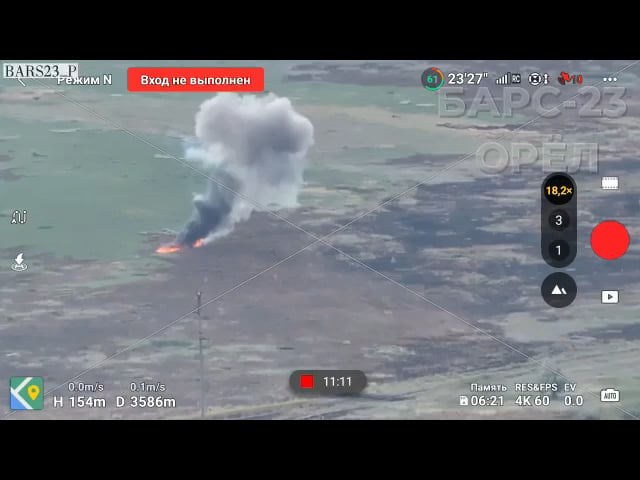 A Russian vehicle in service with the BARS-23 drives over a field and explodes on a TM-62 anti-tank mine, three survivors start running, Vuhledar direction