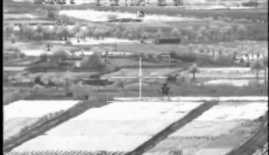 AH-64 Apache taking out a building suspected of hiding IED team in Iraq in 2007, seen through the FLIR of an accompanying AH-64