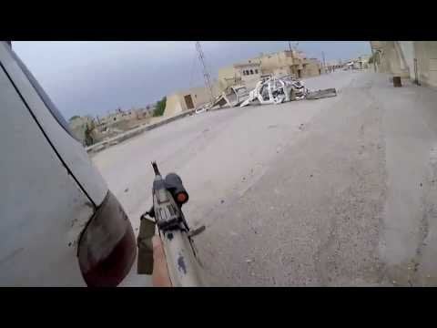 GoPro footage of a Polish Volunteer Fighter whose unit is in a firefight with ISIS fighters in Tabqa, Syria.