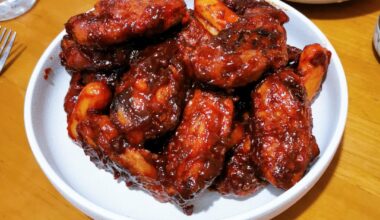 At home Korean fried chicken with tteok and oven-baked garlic parm fries