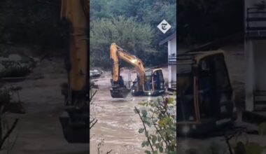 Couple trapped in flooded house rescued with digger