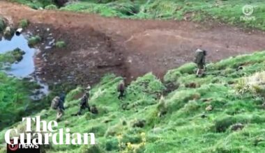 Footage appears to show Tom Phillips and his three children walking in rugged terrain