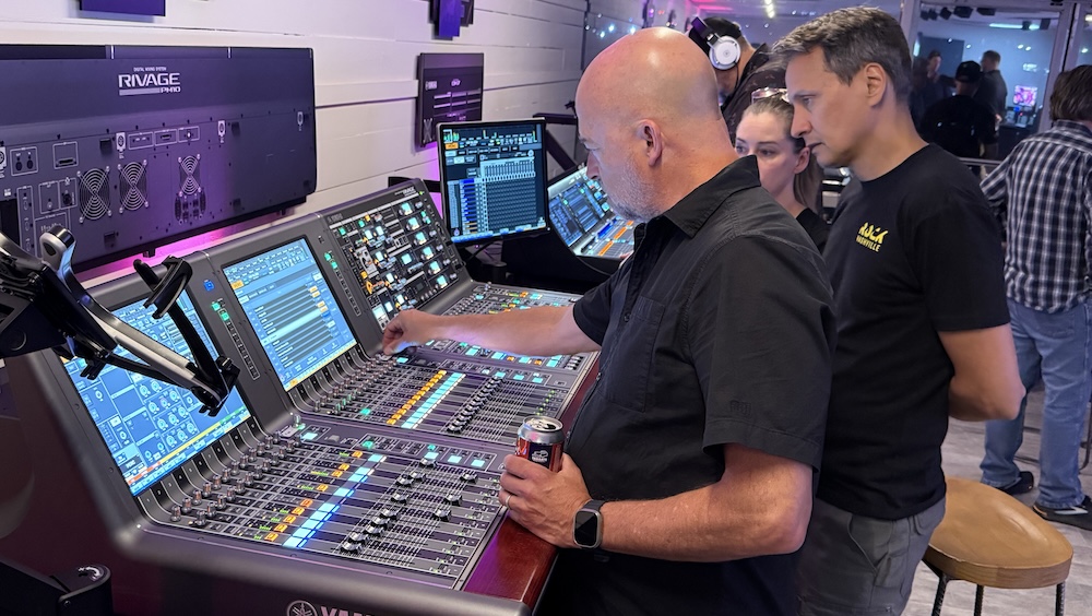 Field marketing engineer Russ Long (foreground) demonstrates the Yamaha Rivage PM10 live mixing console inside Yamaha’s new Nashville demo space.