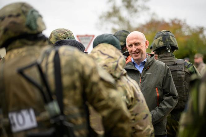 British Defence Secretary John Healey speaks with soldiers and staff at the Stanford Training Area on October 20, 2024, near Thetford, UK.