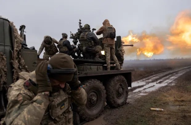 Ukraine has been fending off Putin's army for over two years (pictured: Ukrainian troops on a battle tank)