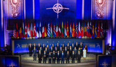 The Heads of State and Government of the 32 NATO Allies and the NATO Secretary General stand together in the Mellon Auditorium in Washington, D.C. – the same room where the 12 founding NATO Allies signed the North Atlantic Treaty 75 years before, on 4 April 1949.