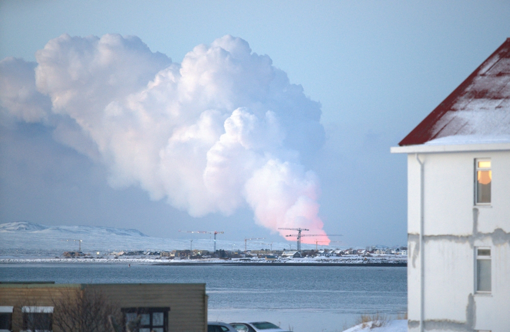 A volcanic eruption is seen in the distance from the Icelandic capital of Reykjavik, Iceland, February 8, 2024. — Reuters pic