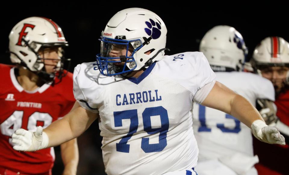 Carroll Cougars Kingston Ayres (79) looks for a player to block Friday, Oct. 25, 2024, during the IHSAA sectional football game against the Frontier Falcons at Frontier High School in Chalmers, Ind. Carroll won 49-21.