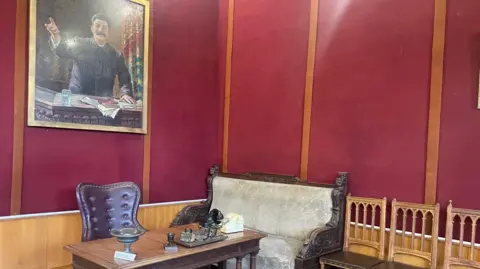 Stalin's desk and old furniture remain in the museum in Gori, along with his childhood home and railway carriage