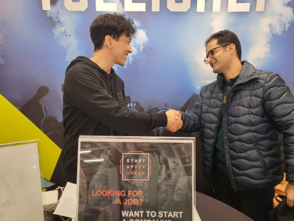 Afghan refugee Aliomid Hashemi (left) at the 'MegaMatchmaking' job fair in Oulu, Finland on September 25, 2024 | Photo: Benjamin Bathke/InfoMigrants