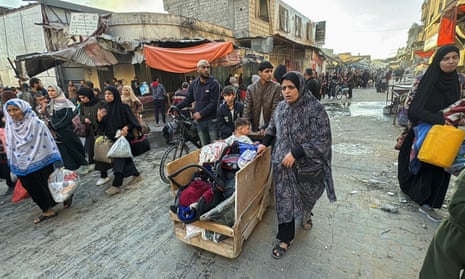 Displaced Palestinians ordered to evacuate their neighbourhoods are pictured in Beit Lahiya in the northern Gaza Strip.