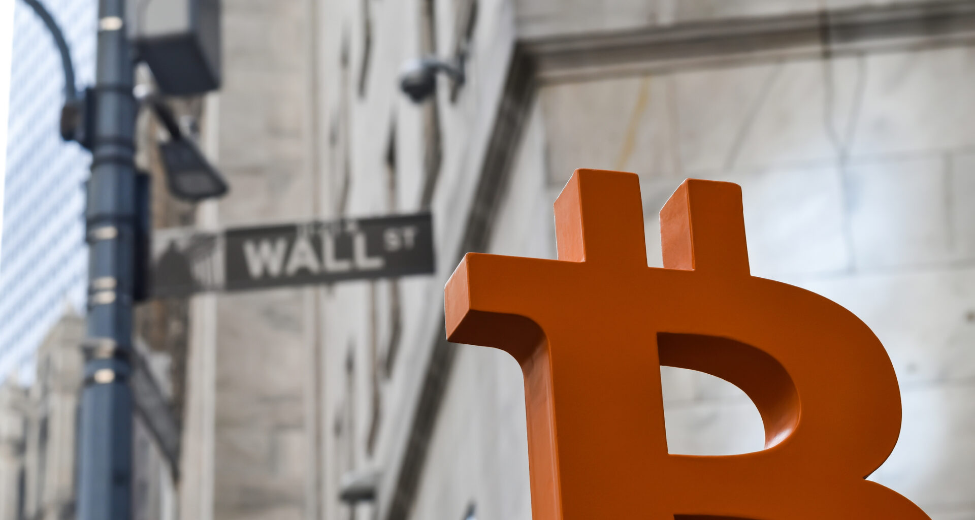 Bitcoin symbol on Wall Street.