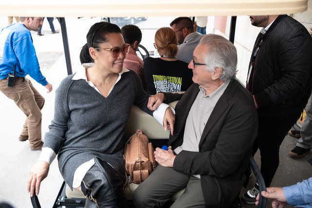 <p>Pedro Gomes/Getty</p> From Left: Tiffany Chen and Robert De Niro on Oct. 18, 2024