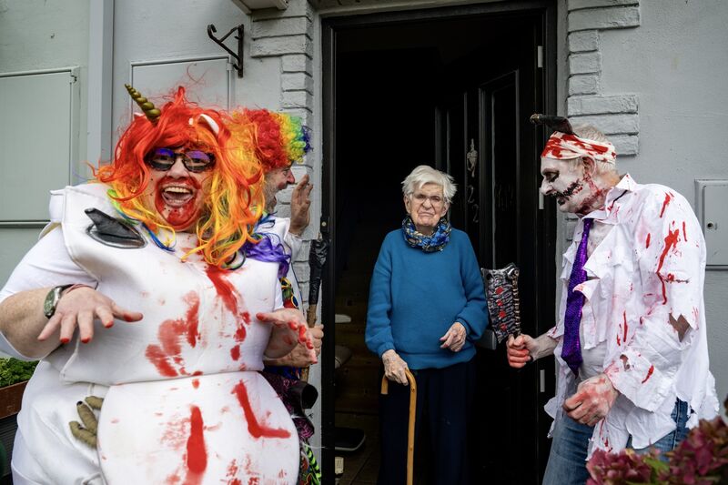 Joan Cronin has a laugh when Cork's oldest trick-or-treaters John A  Murphy, Dotty Duggan and Con Prout make a surprise visit to their 91-year-old neighbour.