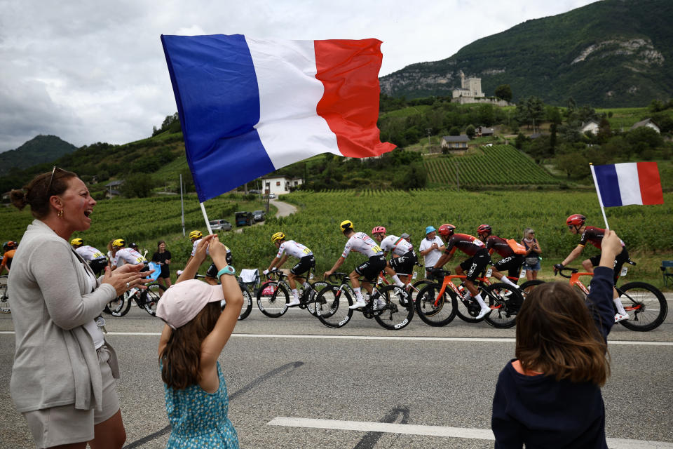 Young fans fly French flags during this year's race. (Anne-Christine Poujoulat/AFP via Getty Images)