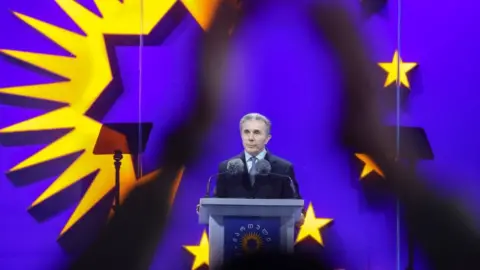 Reuters Founder of the Georgian Dream party Bidzina Ivanishvili delivers a speech during a final campaign rally held by the party's supporters ahead of the upcoming parliamentary elections in Tbilisi, Georgia October 23, 2024