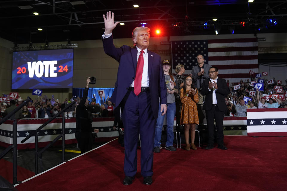 Republican presidential nominee former President Donald Trump waves after a town hall in Lancaster, Pa., Sunday, Oct. 20, 2024. (AP Photo/Evan Vucci)