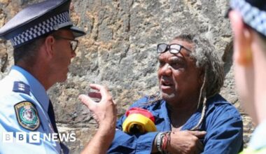 Aboriginal protester arrested during King's Sydney tour