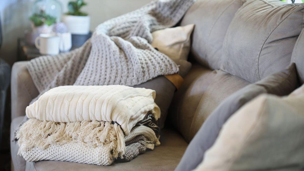 Stack of blankets on couch