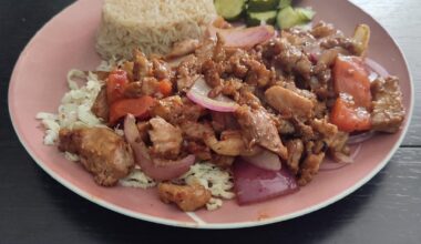 Pork cooked in its own juices and stir-fried, over cabbage, with rice and pickles