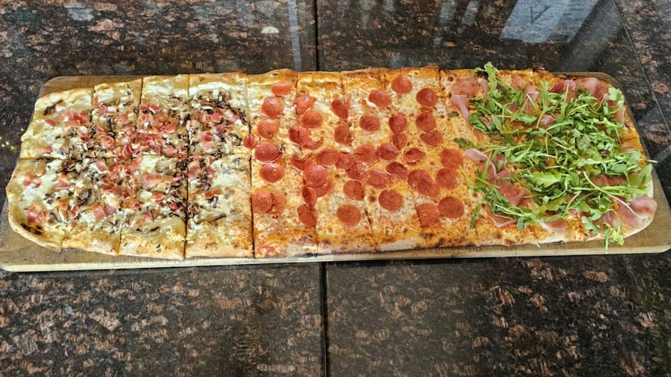 The rectangular pizza is 39 inches long and makes around 20-22 slices- great for parties or...