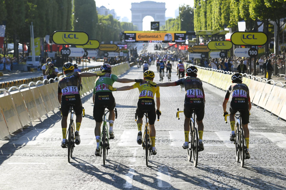 Team Jumbo-Visma poses for a photo on the Champs-Élysées at the end of the 2022 Tour de France. (Stephane Mantey/Getty Images)