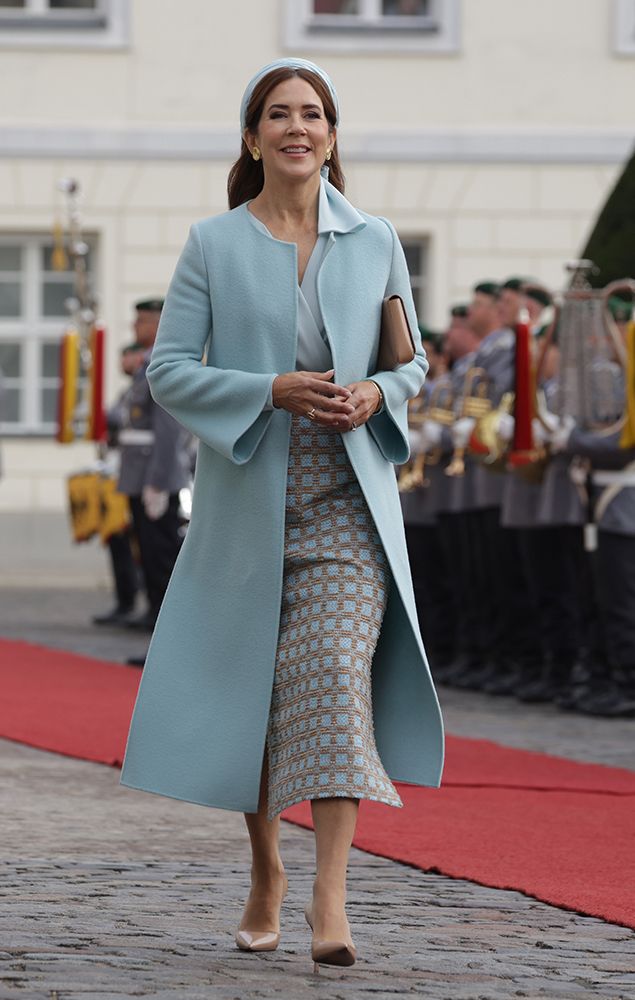 Queen Mary  in a powder blue coat and an Emilia Wickstead skirt