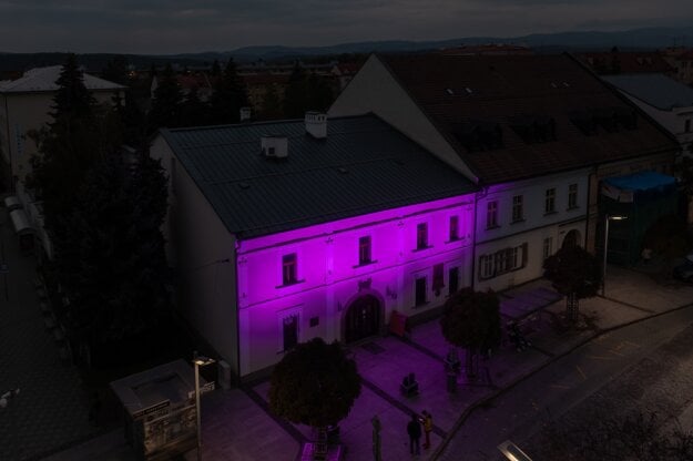 The old town hall in Zvolen is lit up pink on October 15, 2024, during International Breast Cancer Awareness Month.