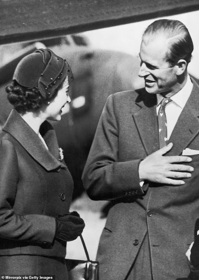 The Queen and Philip, wearing a tie decorated with love hearts, after reuniting in Portugal